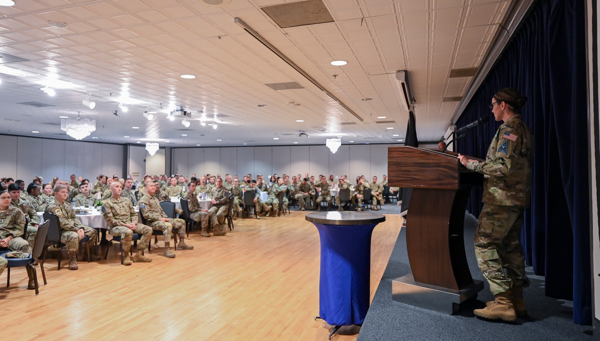 U.S. Space Force Chief Master Sgt. April Brittan, Commandant of the Vosler Academy provides remarks during the Vosler Academy Induction ceremony for Fellowship II, a newly-designed course for mid-tier noncommissioned officers at Peterson Space Force Base, Colo., April 19, 2024. The Fellowship II curriculum—which remains a five-week course—is enriched with foundational Space Force competencies, ensuring a comprehensive understanding of space-centric roles. (U.S. Air Force photo by Capt. Charles Rivezzo)