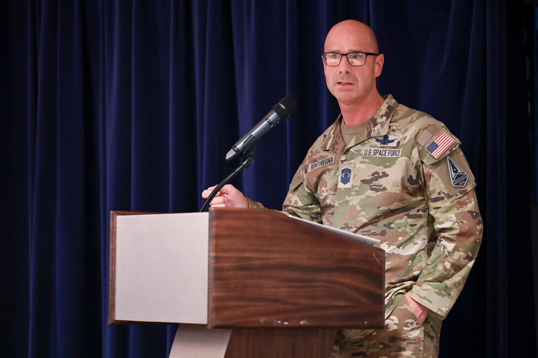 Chief Master Sgt. of the Space Force John Bentivegna provides keynote remarks during the Vosler Academy Induction ceremony for Fellowship II, a newly-designed course for mid-tier noncommissioned officers at Peterson Space Force Base, Colo., April 19, 2024. The Fellowship II curriculum—which remains a five-week course—is enriched with foundational Space Force competencies, ensuring a comprehensive understanding of space-centric roles. (U.S. Air Force photo by Capt. Charles Rivezzo)