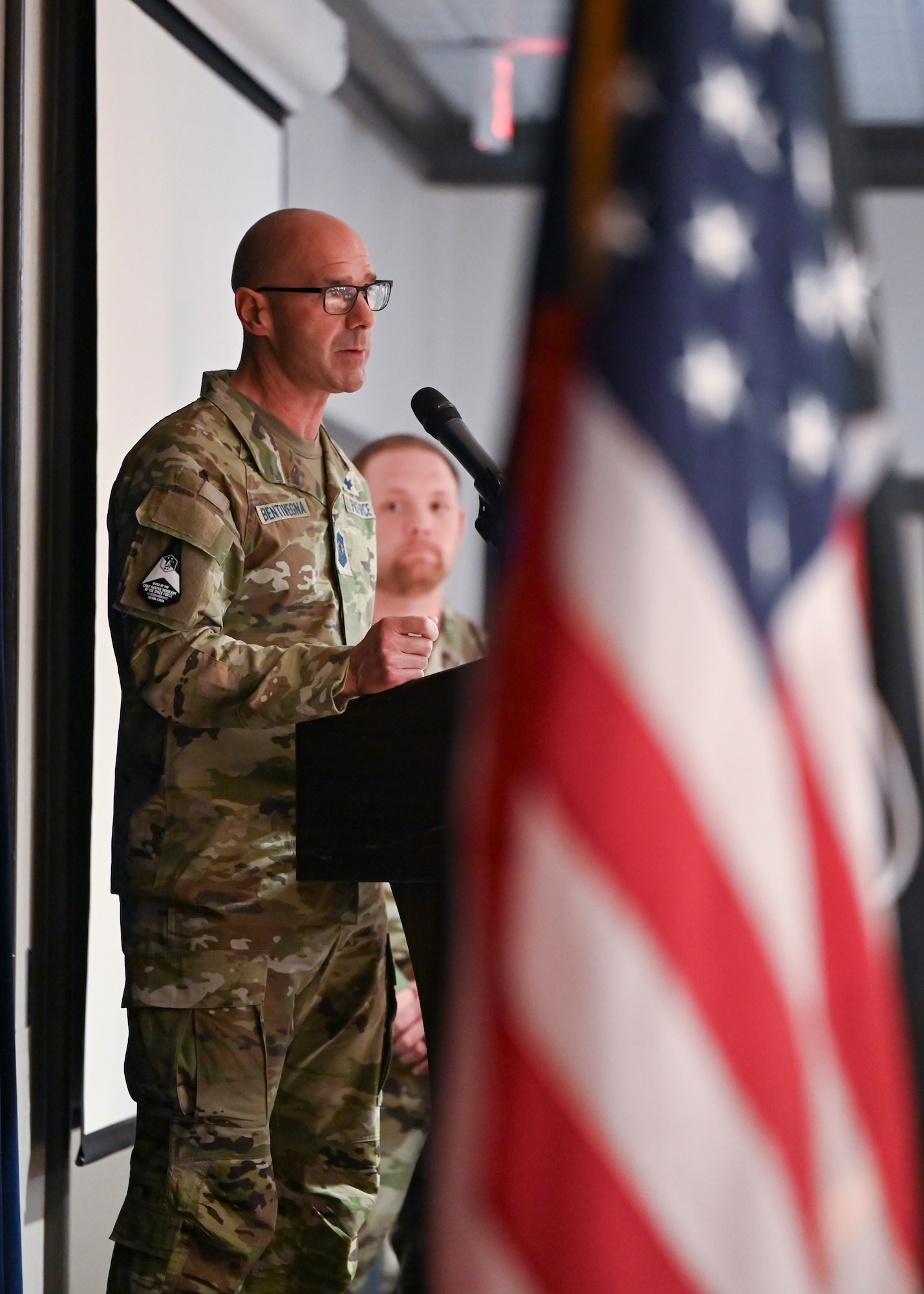 Chief Master Sgt. of the Space Force John Bentivegna provides keynote remarks during the Vosler Academy Induction ceremony for Fellowship II, a newly-designed course for mid-tier noncommissioned officers at Peterson Space Force Base, Colo., April 19, 2024. The Fellowship II curriculum—which remains a five-week course—is enriched with foundational Space Force competencies, ensuring a comprehensive understanding of space-centric roles. (U.S. Air Force photo by Capt. Charles Rivezzo)