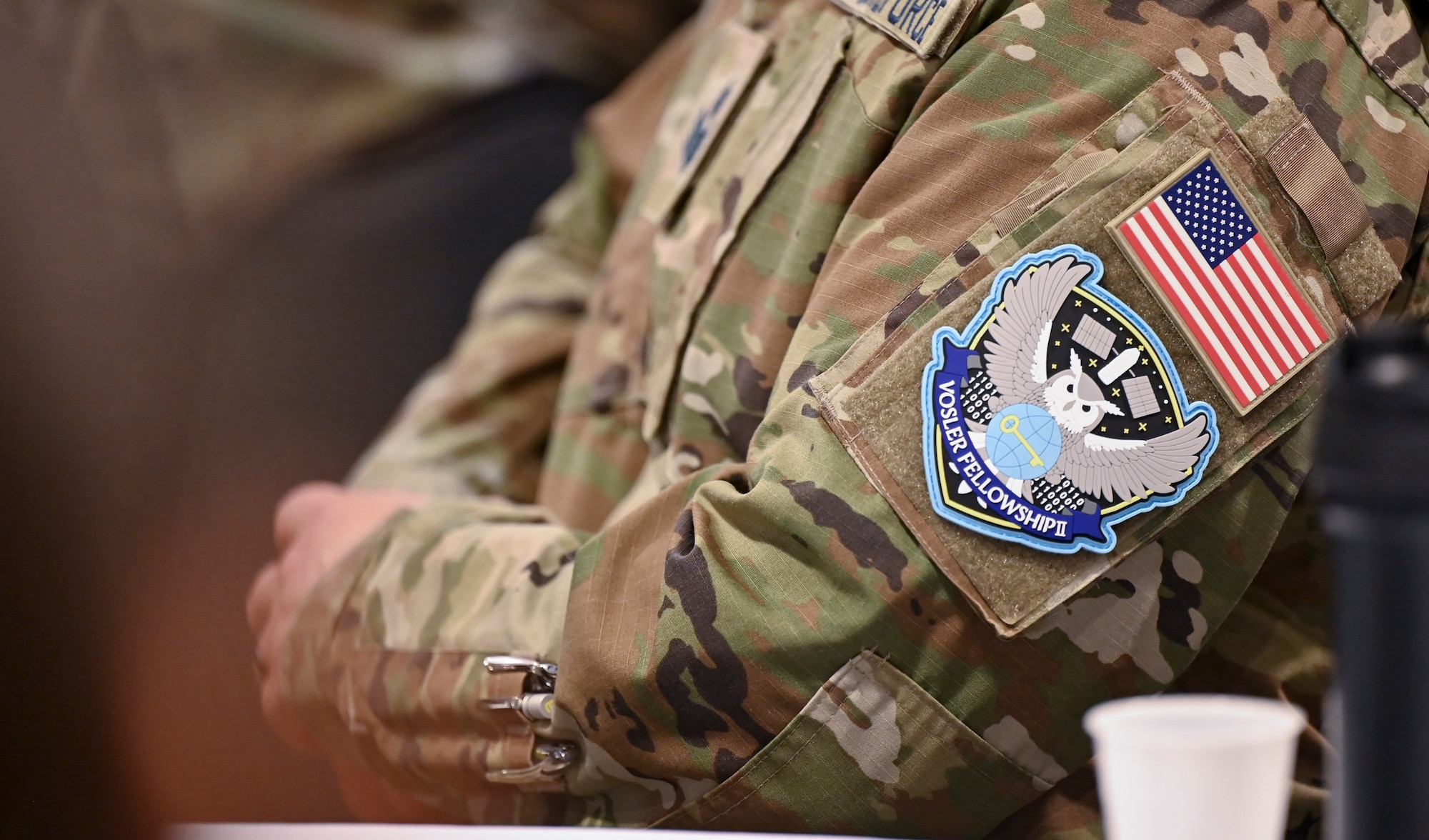 A U.S. Space Force noncommissioned officer awaits his induction into the Vosler Academy Fellowship following his completion of Fellowship II, a newly designed course designed for mid-tier NCOs, at Peterson Space Force Base, Colo., April 19, 2024. The Fellowship II curriculum—which remains a five-week course—is enriched with foundational Space Force competencies, ensuring a comprehensive understanding of space-centric roles. (U.S. Air Force photo by Capt. Charles Rivezzo)