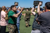 U.S. Marine Corps Sgt. Christian Garibay, a drill instructor with Support Battalion, Recruit Training Regiment, motivates educators from Recruiting Stations Portland, Riverside, San Francisco, and Seattle conducting the ammo can lift portion of the combat fitness test as part of the 2024 Educator’s Workshop at Marine Corps Recruit Depot San Diego, California, April 16, 2024. Participants of the workshop visit MCRD San Diego to observe recruit training and gain a better understanding about the transformation from recruits to United States Marines. Educators also received classes and briefs on the benefits that are provided to service members serving in the United States armed forces. (U.S. Marine Corps photo by Sgt. Jesse K. Carter-Powell)