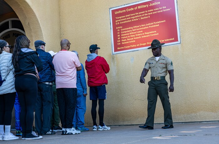 U.S. Marine Corps Sgt. Sharif Adan, a drill instructor with Support Battalion, Recruit Training Regiment, briefs educators from Recruiting Stations Portland, Riverside, San Francisco, and Seattle on the Uniform Code of Military Justice during a mock receiving event as part of the 2024 Educator’s Workshop at Marine Corps Recruit Depot San Diego, California, April 16, 2024. Participants of the workshop visit MCRD San Diego to observe recruit training and gain a better understanding about the transformation from recruits to United States Marines. Educators also received classes and briefs on the benefits that are provided to service members serving in the United States armed forces. (U.S. Marine Corps photo by Sgt. Jesse K. Carter-Powell)