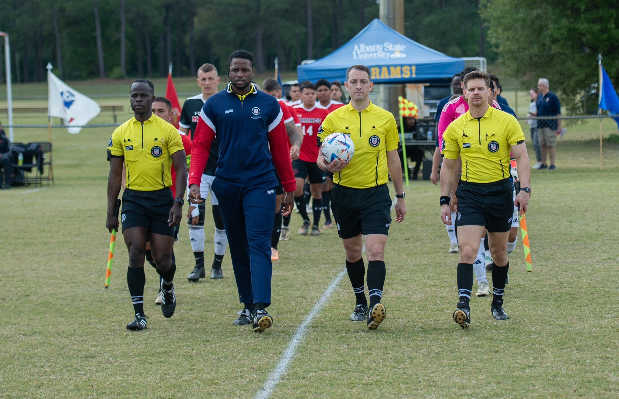 Referees prepare for a soccer game