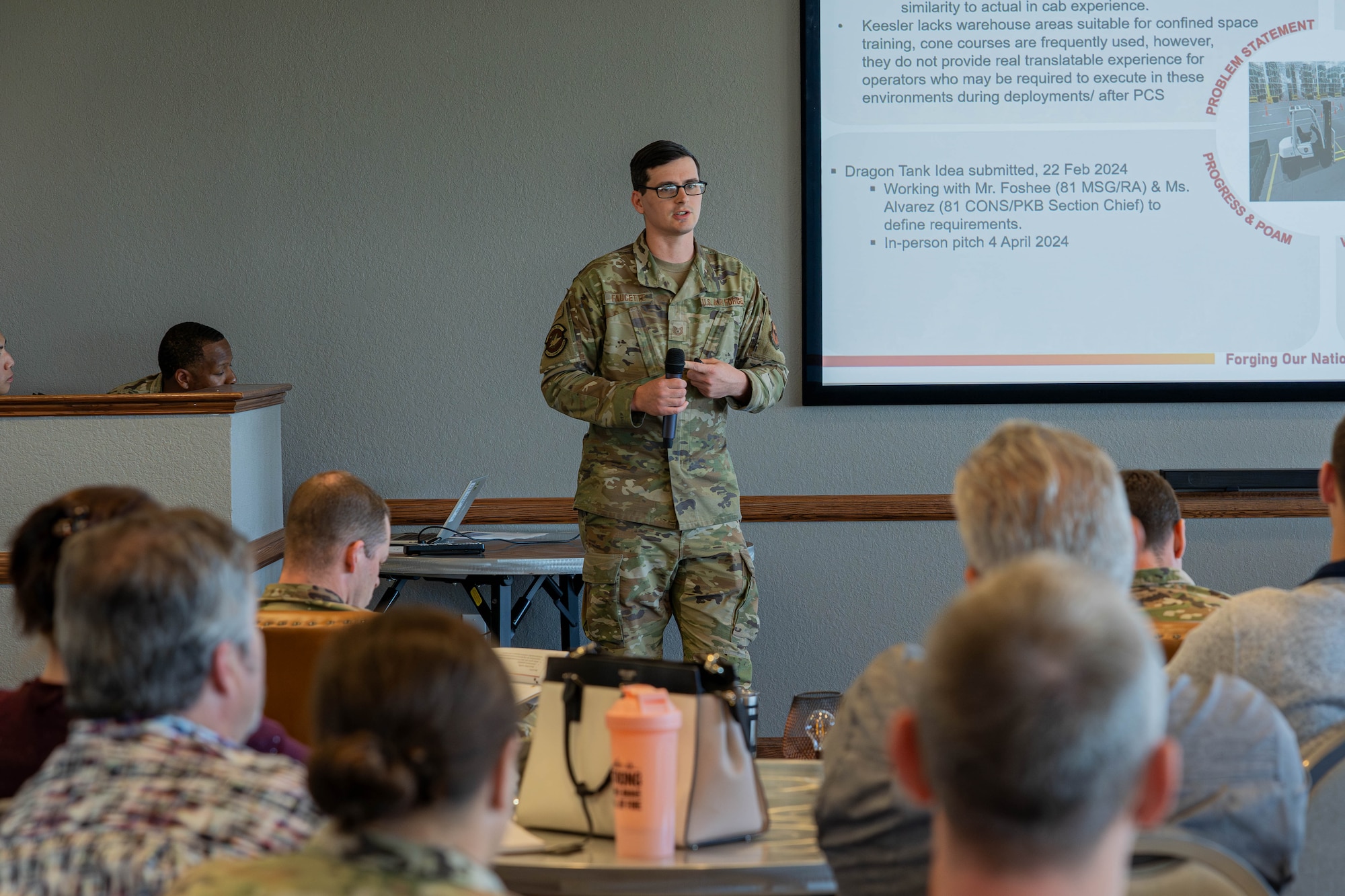 U.S. Air Force Tech. Sgt. Christopher Faucette, 81st Logistics Readiness Squadron NCO in charge, discusses the benefits of a forklift simulator for the Dragon Tank panel at Keesler Air Force Base, April 3, Mississippi, 2024.