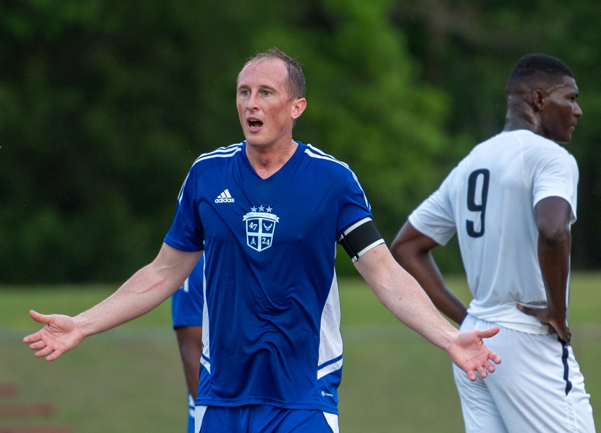 Soccer player reacts to a call during a game