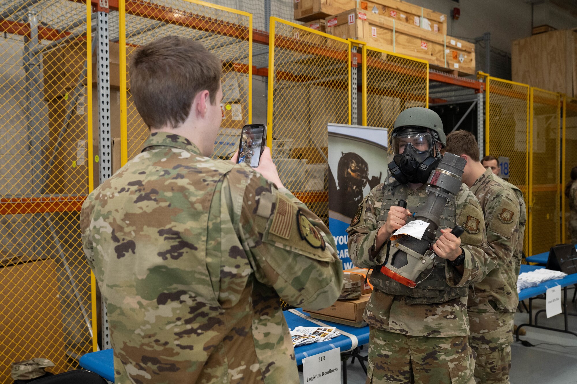 A U.S. Air Force ROTC cadet poses with equipment from the Logistical Readiness Squadron display at Pathways to Blue on Keesler Air Force Base, Mississippi, March 23, 2024.