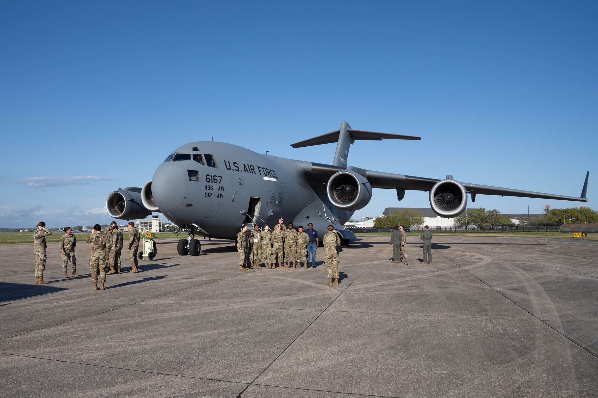 U.S. Air Force ROTC cadets take group photos after deboarding a C-17 Globemaster III on Keesler Air Force Base, Mississippi, March 22, 2024.