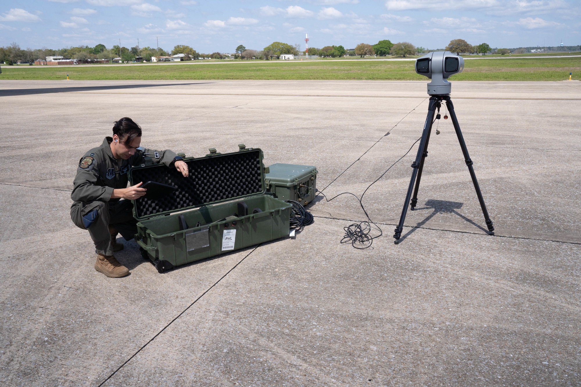 U.S. Air Force Capt. Chris Baude, 326th Airlift Squadron pilot, sets up the Helios platform for a demonstration at Pathways to Blue on Keesler Air Force Base, Mississippi, March 23, 2024.