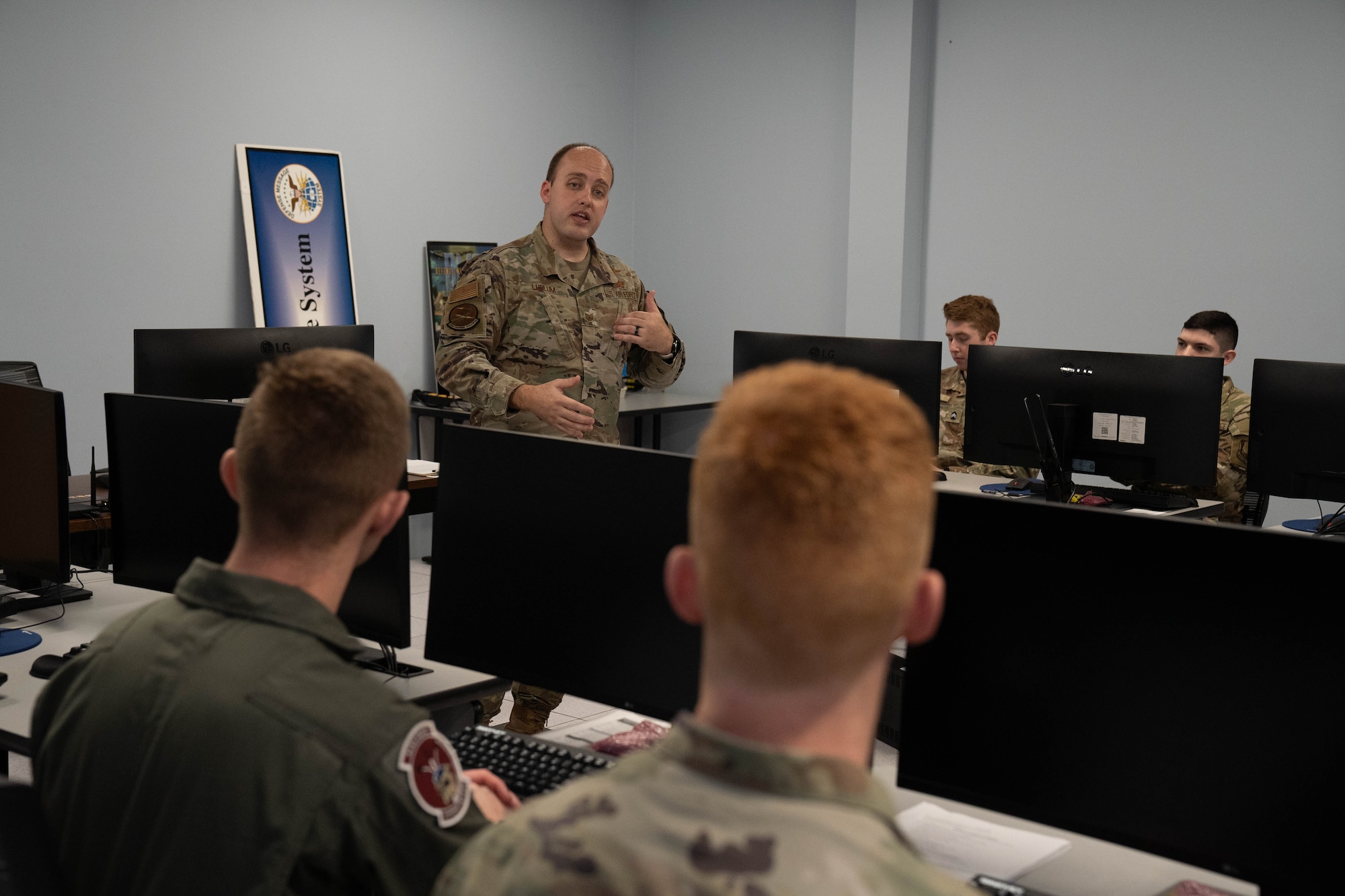 U.S. Air Force Tech. Sgt. Jessie Ludlum, 333rd Training Squadron instructor, explains how students learn fundamental cyber skills at the Tunneling Lab during Pathways to Blue on Keesler Air Force Base, Mississippi, March 23, 2024.