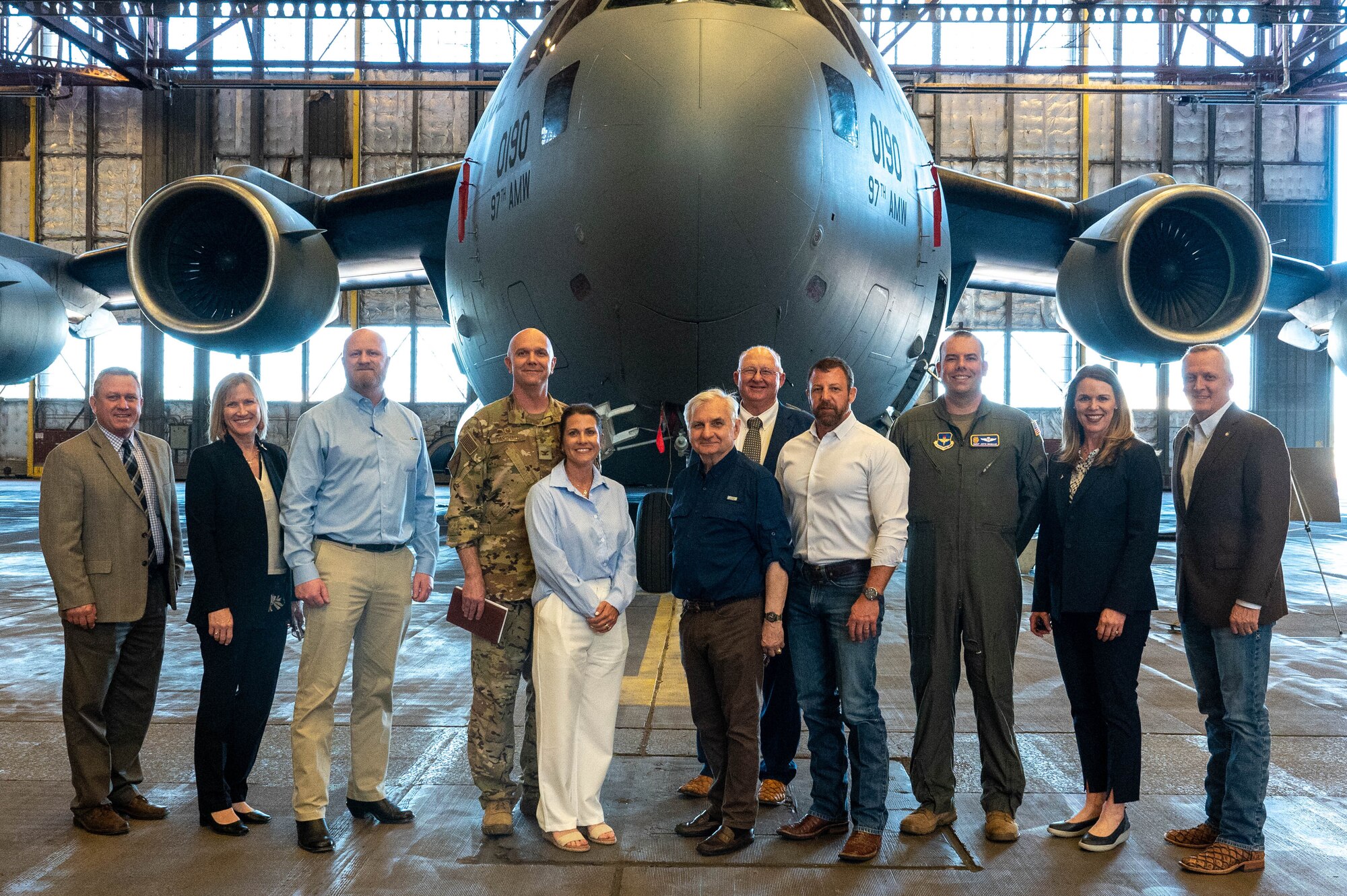 Leaders from the 97th Air Mobility Wing pose for a photo with U.S. senators, Oklahoma representatives, and local civic leaders during their visit at Altus Air Force Base (AFB), Oklahoma, April 12, 2024. The visit was held to share infrastructure updates and current needs at Altus AFB. (U.S. Air Force photo by Airman 1st Class Heidi Bucins)