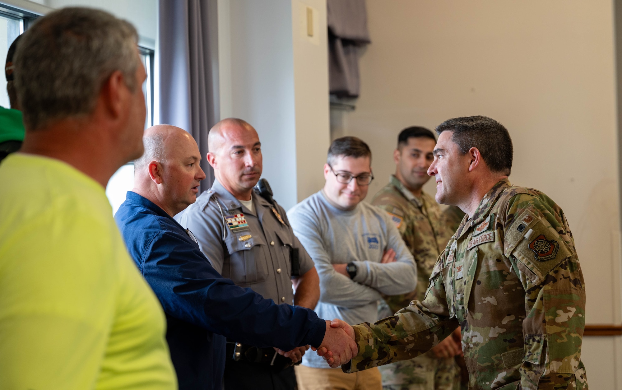 U.S. Air Force Col. Rusty Gohn, 436th Airlift Wing deputy commander, greets guests participating in a motorcycle safety briefing at Dover Air Force Base, Delaware, April 18, 2024. The brief was one of several events hosted by the 436th Airlift Wing Safety Office in recognition of Motorcycle Safety Day. (U.S. Air Force photo by Airman Liberty Matthews)