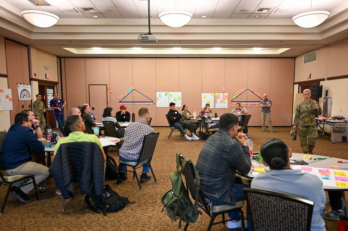 U.S. Air Force Chief Master Sgt. Breana Oliver, 9th Reconnaissance Wing command chief, speaks to the students of the Warfighter-Centered Design (WCD)/Military Scrum Master (MSM) at the Recce Point Club on Beale Air Force Base, California, April 9, 2024.