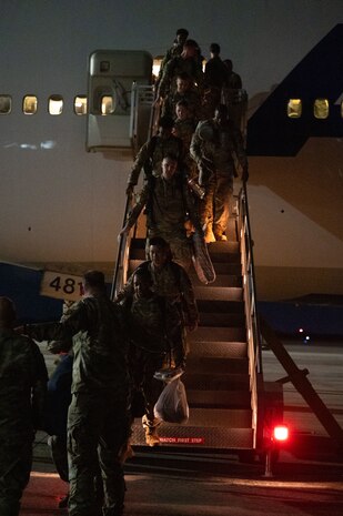 A photo of people high fiving.