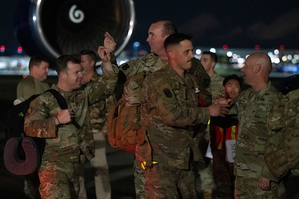 A photo of people high fiving.