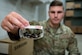An insect trap is being shown by U.S. Air Force Senior Airman Christopher Cauldwell, 633d Civil Engineer Squadron pest management journeyman, at Joint Base Langley Eustis, Dec. 4, 2023. Insect traps often utilize pheromones, chemical signals emitted by insects, to attract and capture specific pests, providing a targeted and eco-friendly approach to pest management. (U.S. Air Force photo by Airman 1st Class Skylar Ellis)