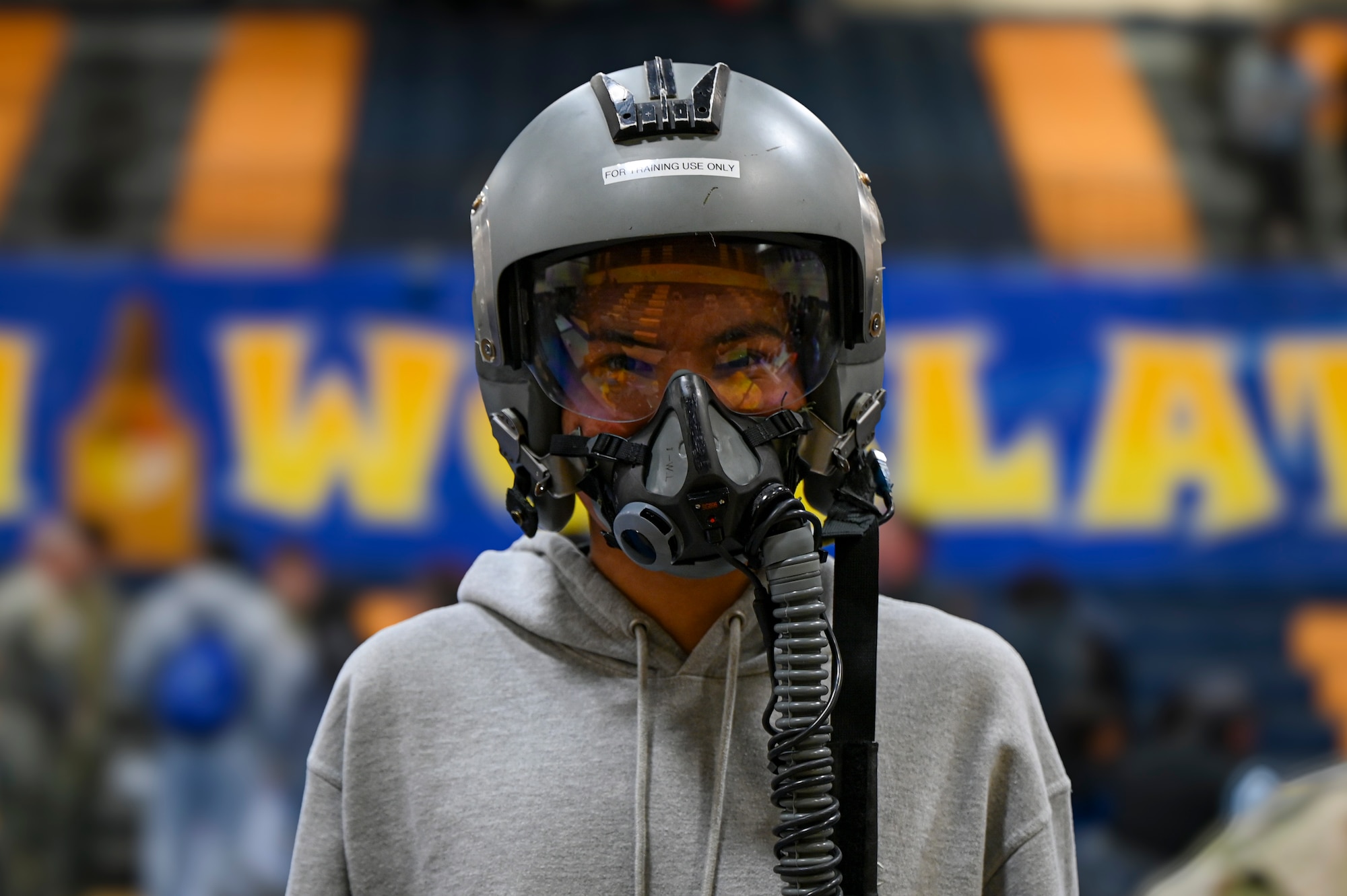 A student wears a training flight helmet.