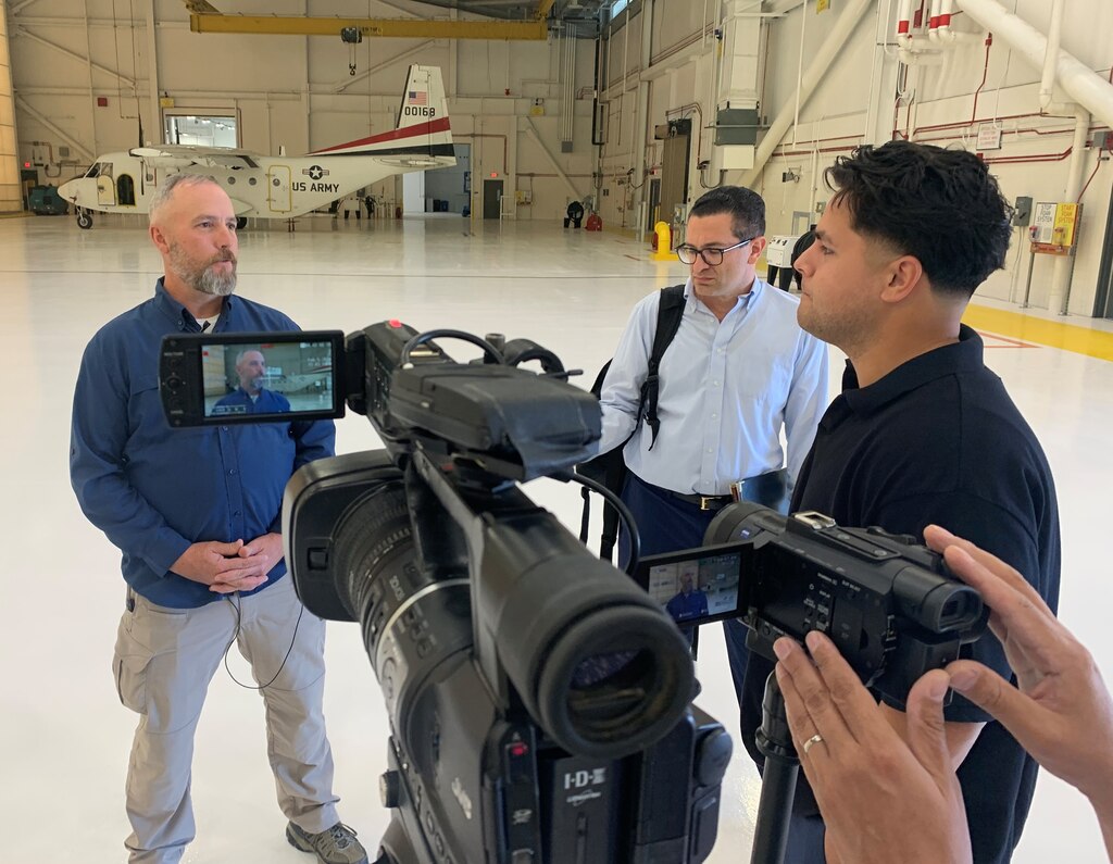 Jason Russell, a U.S. Army Corps of Engineers Los Angeles District project engineer, expresses the LA District's support for American troops during a media interview April 9 at Yuma Proving Ground in Arizona. LA District and Yuma Proving Ground military leaders celebrated the official completion of a facility for the U.S. Army Special Operations Aviation Command during a ribbon-cutting ceremony on the same day at the installation.