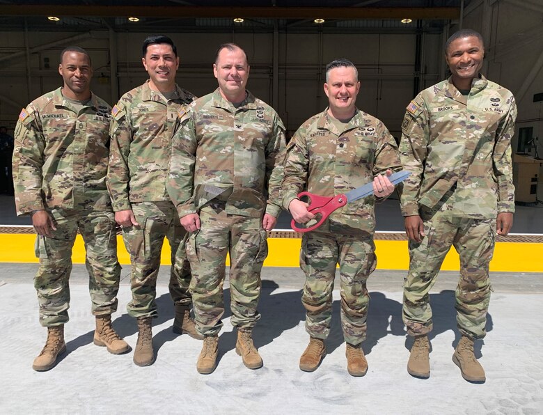 Military leaders with Yuma Proving Ground and the U.S. Army Corps of Engineers Los Angeles District pose for a photo following an April 9 ribbon-cutting ceremony for the completion of a two-bay hangar for the Special Operations Aviation Command flight detachment at Yuma Proving Ground, Arizona.