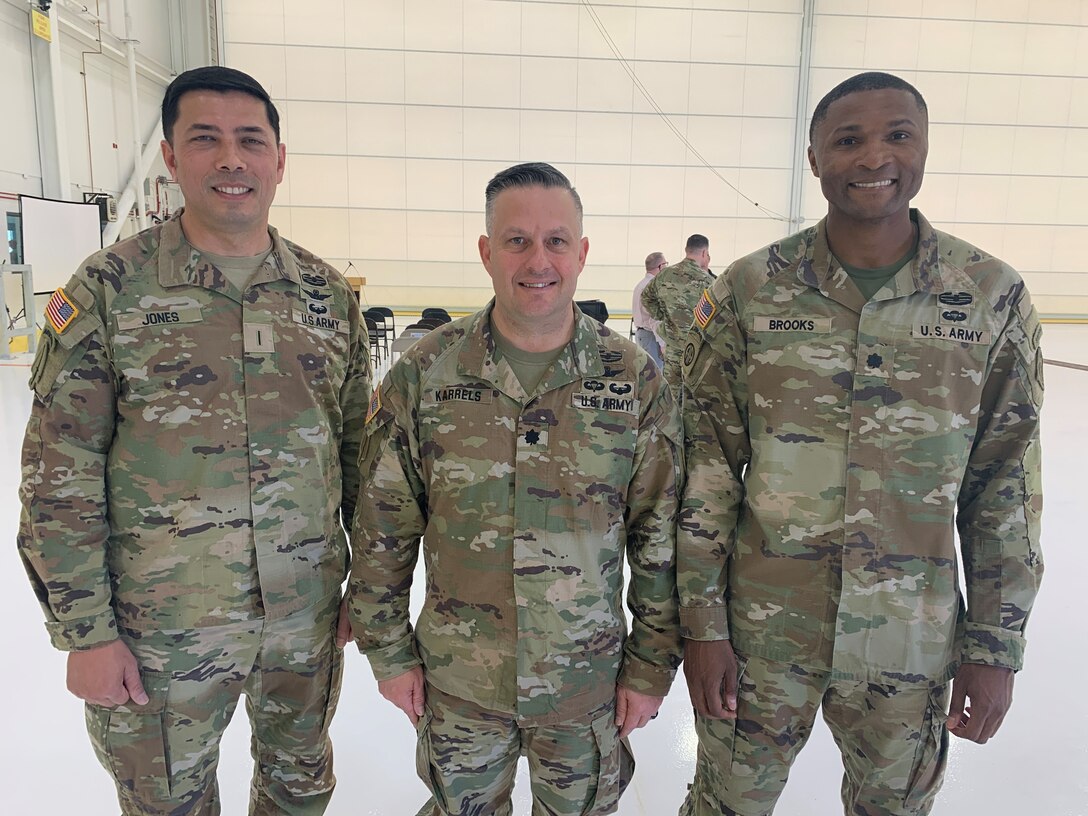 From left to right, Chief Warrant Officer 5 David Jones, Special Operations Aviation Command flight detachment commander; Lt. Col. Sean Karrels, battalion commander, 160th Special Operations Aviation Regiment; and Lt. Col. Stephen Brooks, U.S. Army Corps of Engineers Los Angeles District deputy commander, pose for a picture following an April 9 ribbon-cutting ceremony for the completion of a two-bay hangar for the Special Operations Aviation Command flight detachment at Yuma Proving Ground, Arizona.
