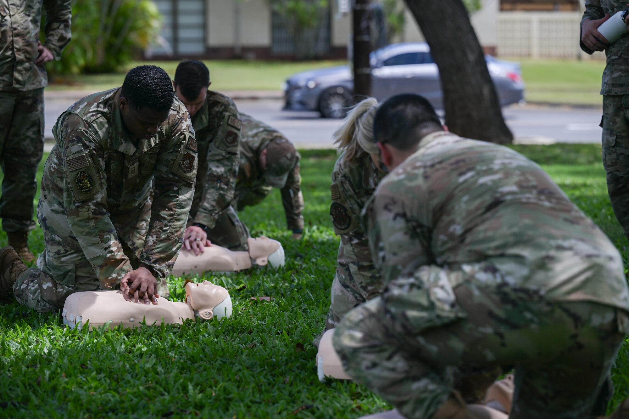 Airmen demonstrate cardiopulmonary resuscitation during an exercise.