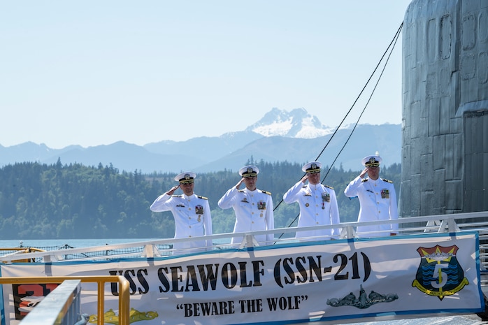 Members of the official party depart the Seawolf-class fast-attack submarine USS Seawolf (SSN 21) following a change of command ceremony held at Naval Base Kitsap-Bangor in Silverdale, Washington, May 16, 2023. During the ceremony, Cmdr. Jeffrey Fassbender was relieved by Cmdr. Douglas Hagenbuch. (U.S. Navy photo by Mass Communication Specialist Seaman Sophia H. Bumps)