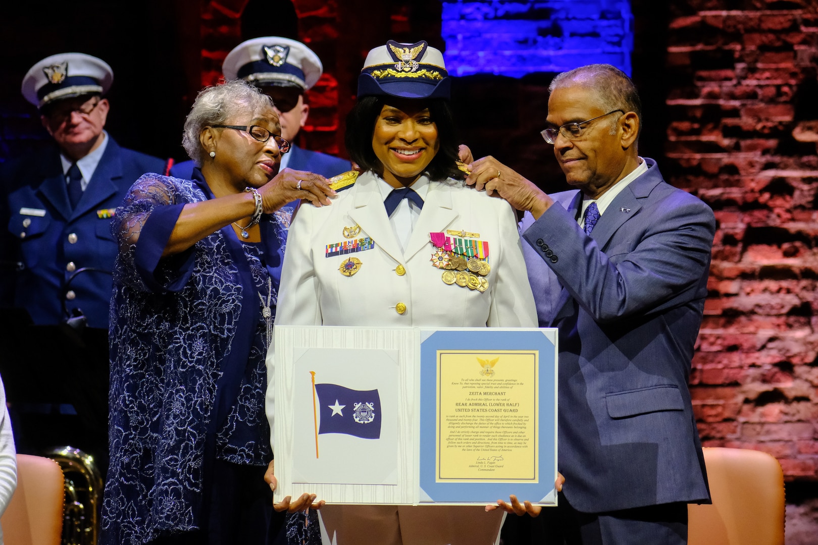 Capt. Zeita Merchant, the outgoing Coast Guard Sector New York commander is shown being frocked to rear admiral lower half, during a ceremony at the Richard Rodgers Theatre in Manhattan, New York, April 22, 2024. Merchant is the first the first African-American woman to achieve this rank in the nearly 234-year history of the military service. (U.S. Coast Guard photo by Petty Officer 2nd Class Ryan Schultz)