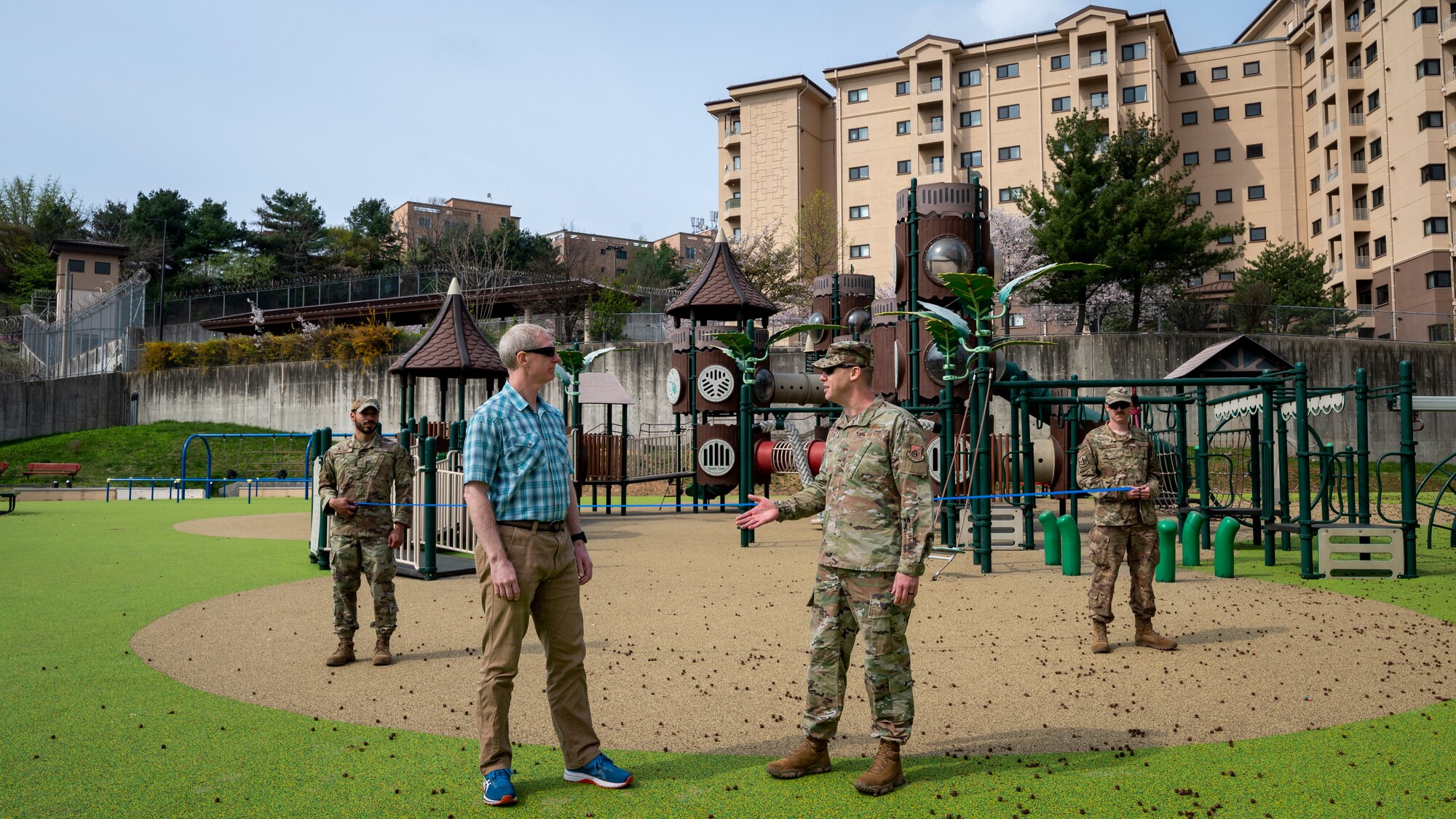 U.S. Air Force Airmen assigned to the 51st Fighter Wing and Camp Yongsan-Casey celebrate the ribbon cutting of Northlake Park at Osan Air Base, Republic of Korea, April 10, 2024. The playground equipment was donated by Camp Yongsan-Casey and the project was recently completed. The joint effort of Osan AB and Camp Yongsan-Casey supported Airmen and their families by providing a space to interact with community members and perform physical activities. (U.S. Air Force photo by Senior Airman Sabrina Fuller-Judd)