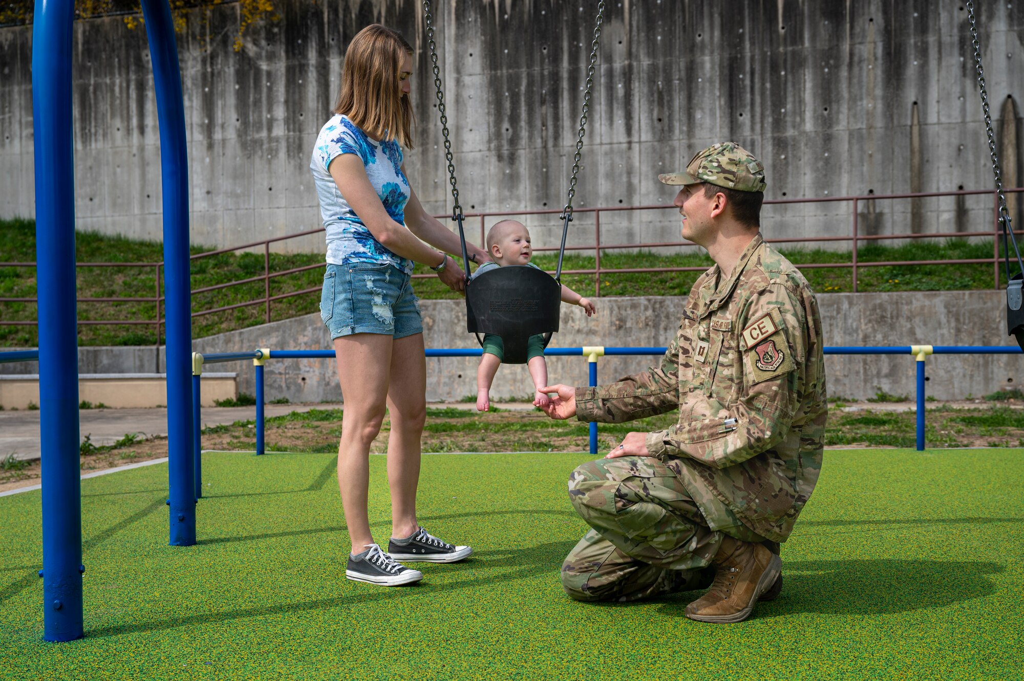 U.S. Air Force Capt. Justin Dollar, 51st Civil Engineer Squadron officer in charge of construction, and his family play at the newly opened Northlake Park at Osan Air Base, Republic of Korea, April 10, 2024. The new playground adds another recreational space for Airmen and their families to do outdoor activities and connect with other military families. (U.S. Air Force photo by Senior Airman Sabrina Fuller-Judd)
