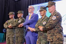 Philippine and U.S. government and military representatives conduct the “crossing of hands” during the opening ceremony to commence Balikatan 24 at Camp Aguinaldo, Manila, Philippines, April 22, 2024. BK 24 is an annual exercise between the Armed Forces of the Philippines and the U.S. military designed to strengthen bilateral interoperability, capabilities, trust, and cooperation built over decades of shared experiences (U.S. Marine Corps Lance Cpl. Erica Stanke)