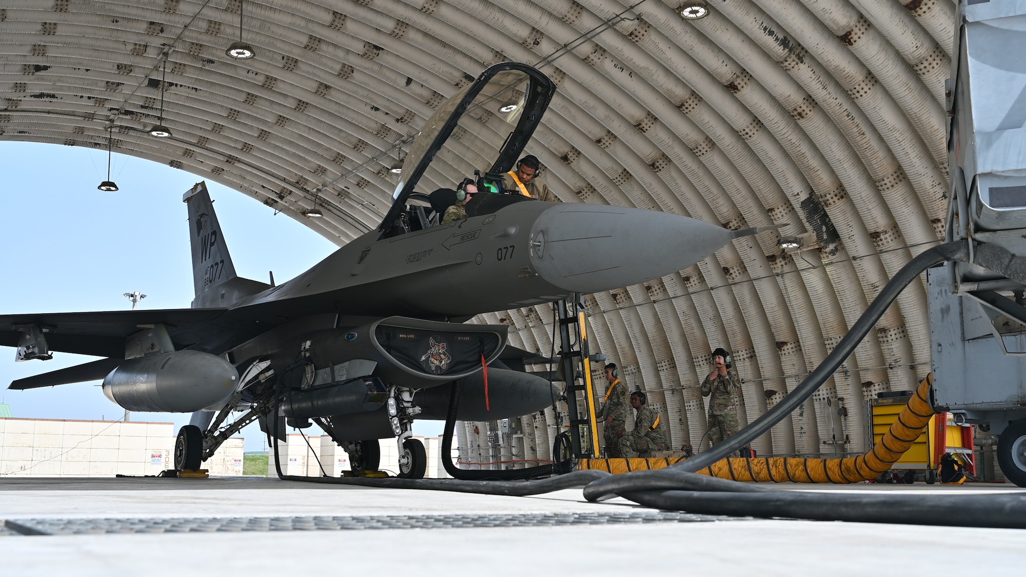 Maintainers from the 80th Fighter Generation Squadron conduct maintenance procedures on a U.S. Air Force F-16 Fighting Falcon.
