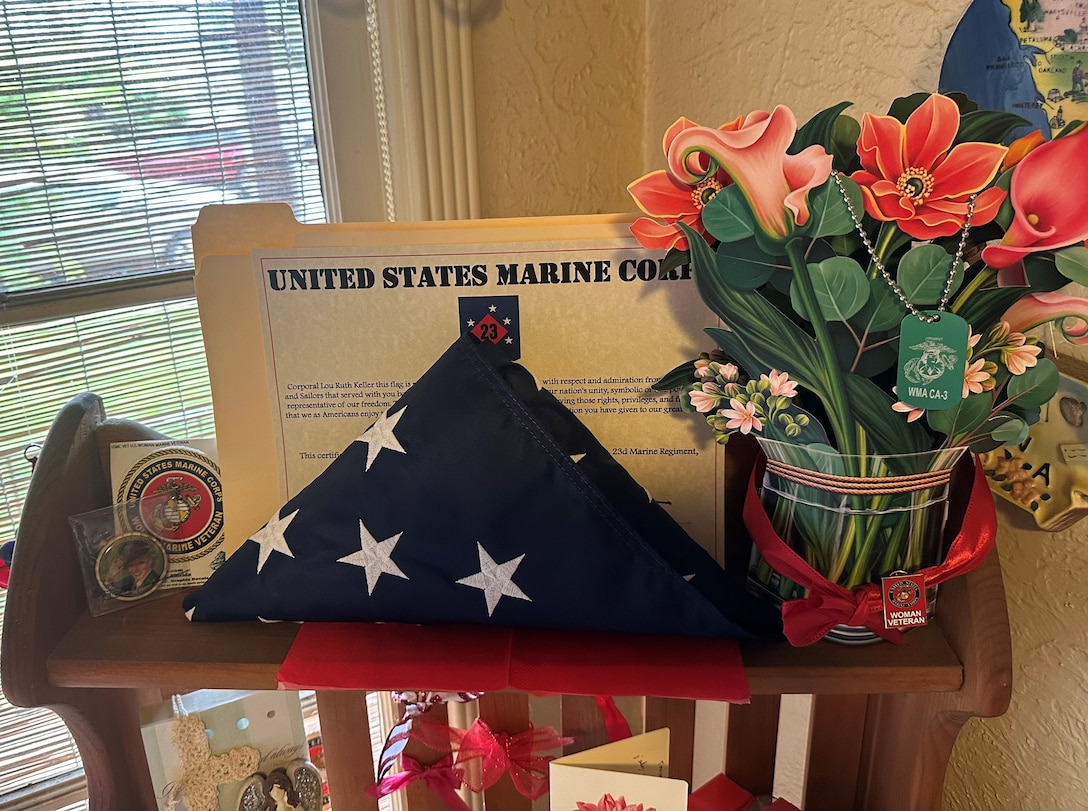 A folded flag that was flown over Headquarters Battalion, 23d Marine Regiment, 4th Marine Division in honor of retired U.S. Marine Corps Corporal Lou 'Mama Lou' Keller and presented to her on her 99th Birthday in San Jose, CA, March 30, 2024. Mama Lou enlisted in the Marines during WWII in honor of her father who was a WW1 veteran and passed away at the age of 50.