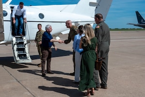 The 97th Air Mobility Wing command team and their spouses welcome U.S. Sen. Jack Reed, middle, and U.S. Sen. Markwayne Mullin, left, for a visit at Altus Air Force Base (AFB), Oklahoma, April 12, 2024. Reed and Mullin visited Altus AFB as one of several military installations they toured in Oklahoma. (U.S. Air Force photo by Airman 1st Class Heidi Bucins)
