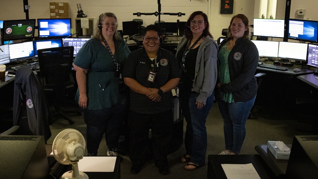 Dispatchers with Security Emergency Services pose for a photo during National Public Safety Telecommunicator Week on Marine Corps Base Camp Lejeune, North Carolina, April 9, 2024. During the month of April, National Public Safety Telecommunicators Week is held to honor personnel in the public safety sector for their dedicated service to the community. (U.S. Marine Corps photo by Cpl. Jennifer E. Douds)