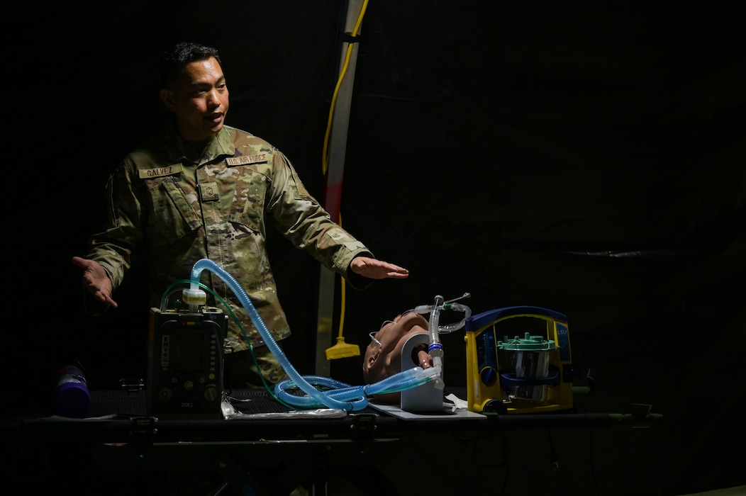 Airmen demonstrates use of medical equipment.