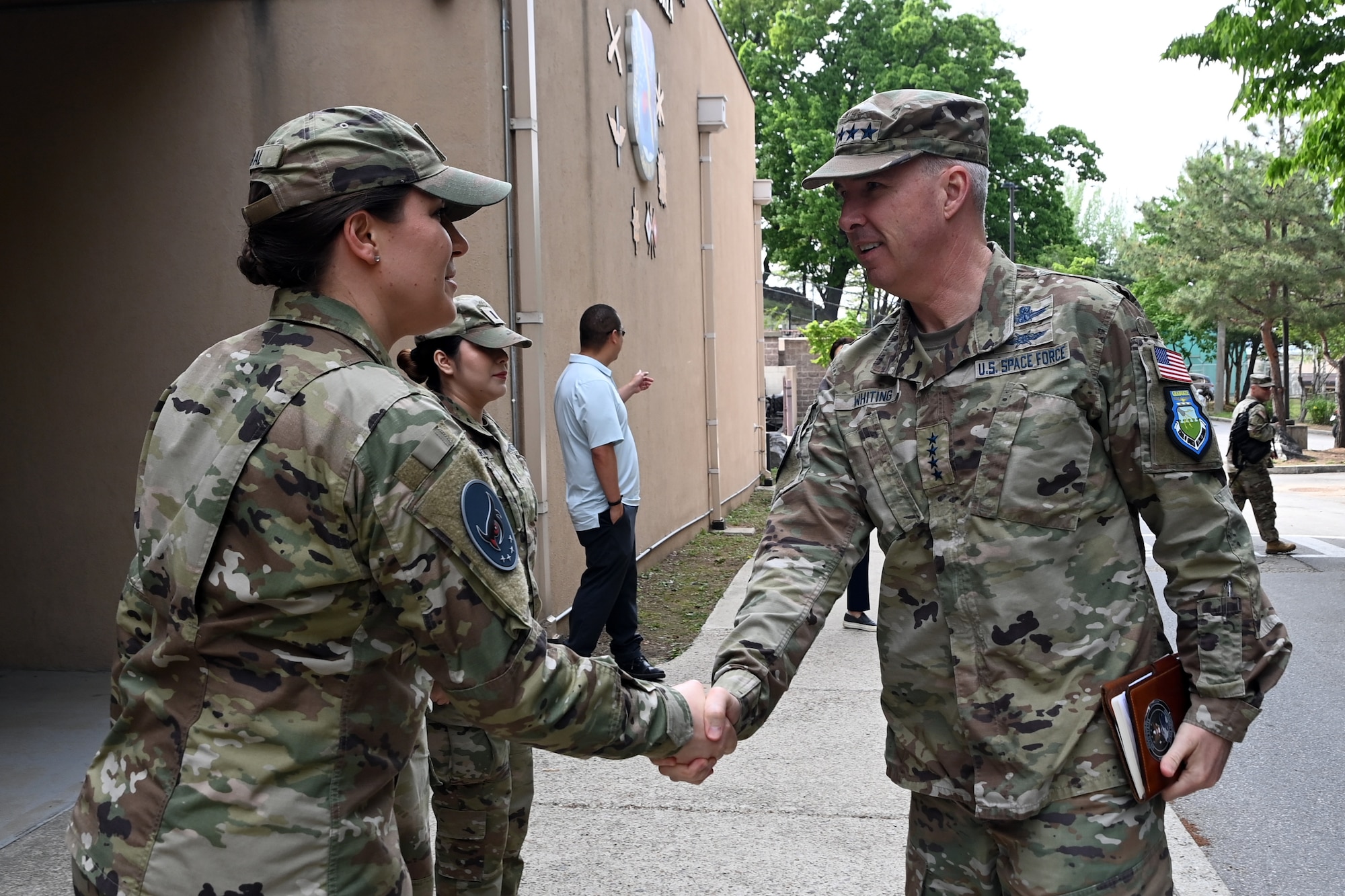 U.S. Space Force Capt. April Dybal, 5th Space Warning Squadron Detachment 3 commander, greets Gen. Stephen Whiting, Commander of the U.S. Space Command, during a visit to Osan Air Base, Republic of Korea, April 22, 2024.