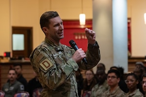 U.S. Air Force Col. Ryan Garlow, 100th Air Refueling Wing commander, speaks to Airmen during a wing all-call at Royal Air Force Mildenhall, England, April 18, 2024.