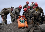 U.S. Army Soldiers from the New York National Guard’s 827th Engineer Company, 104th Military Police Battalion, lower a simulated casualty from rubble during a training exercise April 17, 2024. Led by personnel from the 42nd Infantry Division making up the Region II Homeland Response Force, the week-long exercise brought together elements from across the New York National Guard.