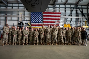 Religious support military members gather for a group photo during a joint religious support team training