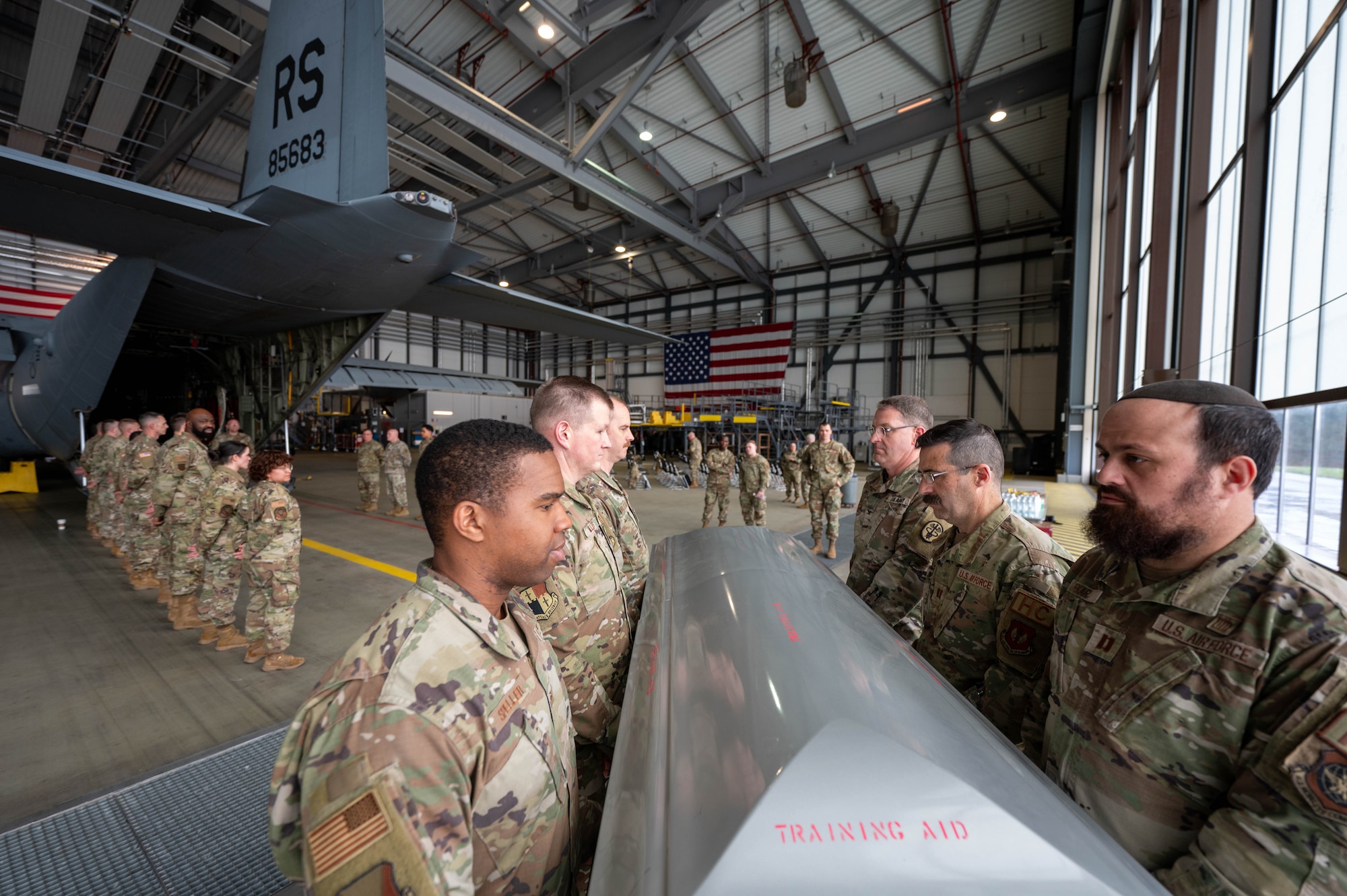 Religious support military members participate in a ramp ceremony training