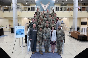 Maj. Gen. Daniel A. DeVoe, commander of the Air Force District of Washington, Command Chief Master Sgt. Charmaine Kelley, Col. Todd E. Randolph, commander of the 316th Wing, and his wife Mrs. Penny Randolph; and 11th Wing Command Chief Master Sgt. Clifford L. Lawton pose for a photo with participants of the Squadron Leadership Course, April 19, 2024, at the Jacob Smart Conference Center on Joint Base Andrews, Maryland.