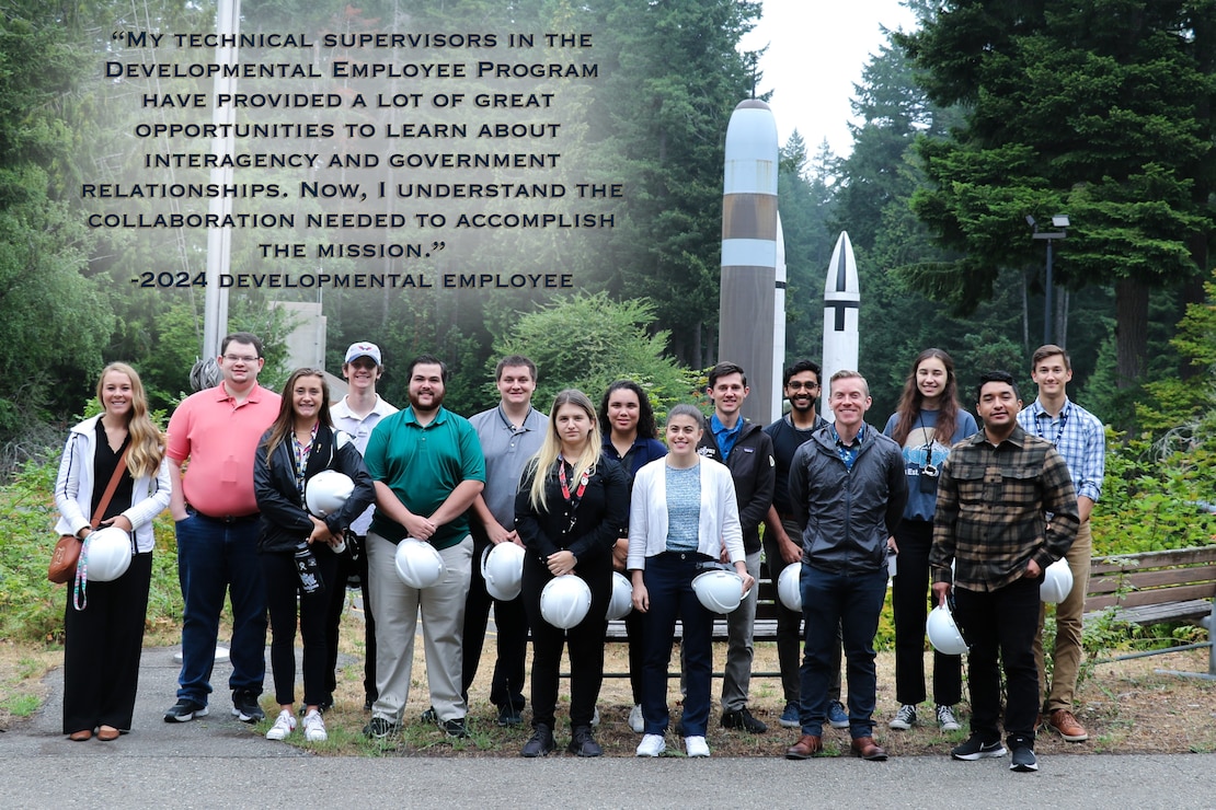 A group of student interns and developmental employees take a tour of the Strategic Systems Programs (SSP) field site Strategic Weapons Facility-Pacific (SWFPAC). They are standing in front of the missile display at SWFLANT's headquarters building. SSP is the command that holds the cradle-to-grave responsibility for the submarine-launched ballistic missile system. SSP oversees all aspects of research, development, production, logistics, storage, repair, and operational support for the system.