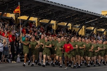 New U.S. Marines with Alpha Company, 1st Recruit Training Battalion, run in formation during a motivational run at Marine Corps Recruit Depot San Diego, California, April 18, 2024. The motivational run is the last physical training exercise Marines conduct while at MCRD. (U.S. Marine Corps photo by Cpl. Alexander O. Devereux)
