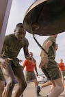 A new U.S. Marine with Alpha Company, 1st Recruit Training Battalion, rings the liberty bell during a motivational run at Marine Corps Recruit Depot San Diego, California, April 18, 2024. The motivational run is the final training event new Marines complete before graduating which consists of a three-mile run throughout the Depot. (U.S. Marine Corps photo by Lance Cpl. Alexandra M. Earl)