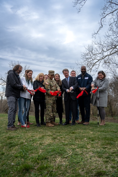 Members of the U.S. Army Corps of Engineers Louisville District and the Indianapolis community celebrate a ribbon cutting ceremony for the Indianapolis North Levee System in Indianapolis, Indiana, March 21, 2024.