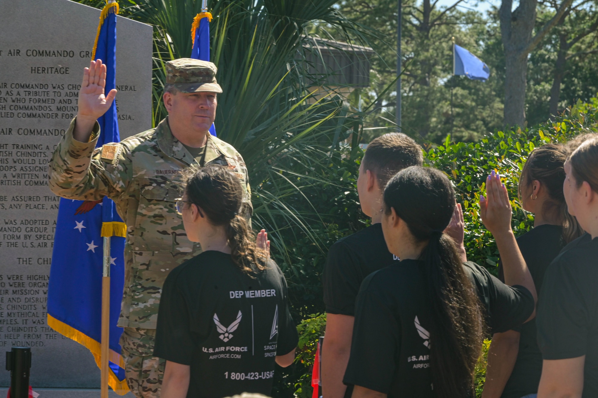 U.S. Air Force Lt. Gen. Tony Bauernfeind, Air Force Special Operations Command Commander, issues the oath of enlistment during the grand reopening of the memorial air park at Hurlburt Field, Florida, April 22, 2024.