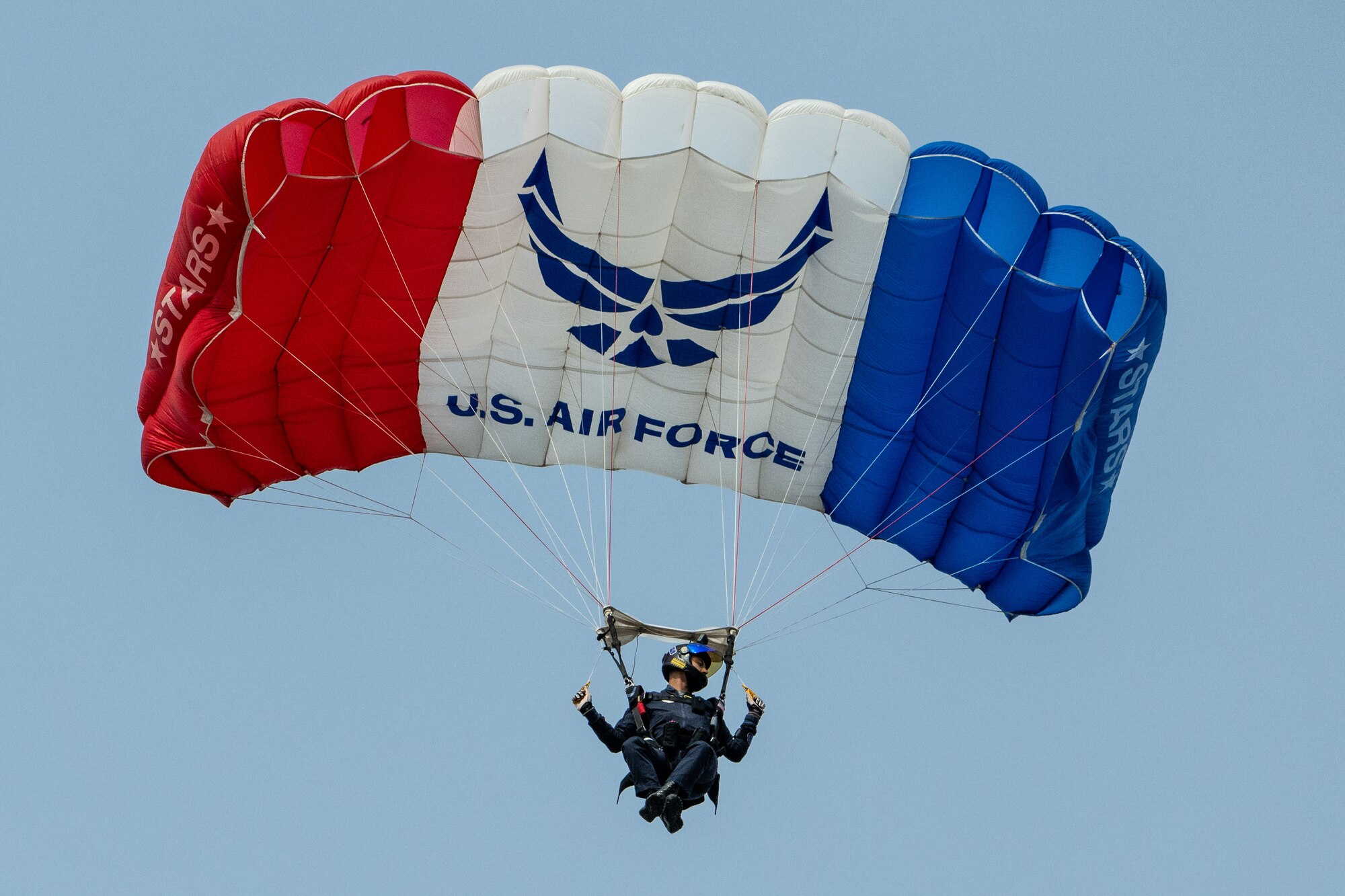 An Airman from the U.S. Air Force Academy Wings of Blue demo team parachutes into Slugger Field during the Thunder Over Louisville air show in Louisville, Ky., April 20, 2024. This year’s event featured more than two-dozen military and civilian aircraft, including the Kentucky Air National Guard’s C130J Super Hercules. (U.S. Air National Guard photo by Dale Greer)