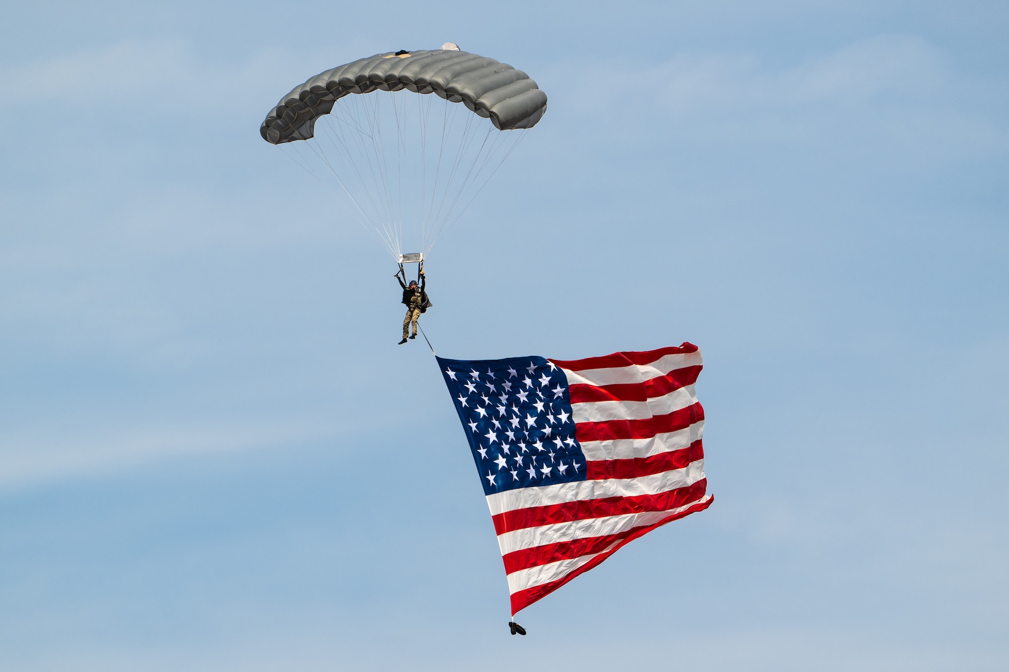 A pararescueman from the Kentucky Air National Guard’s 123rd Special Tactics Squadron parachutes into the Ohio River as part of a demonstration during the Thunder Over Louisville air show in Louisville, Ky., April 20, 2024. This year’s event featured more than two-dozen military and civilian planes, including the Kentucky Air National Guard’s C130J Super Hercules. (U.S. Air National Guard photo by Dale Greer)