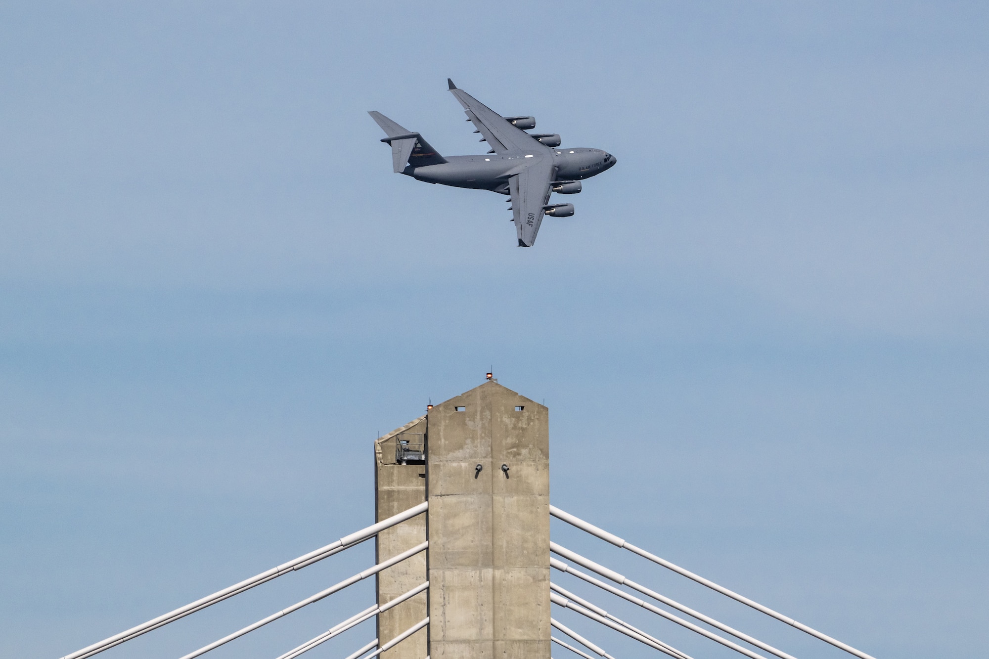 A U.S. Air Force C-17 Globemaster III from the 97th Airlift Wing at Altus Air Force Base, Okla., performs an aerobatic display during the Thunder Over Louisville air show in Louisville, Ky., April 20, 2024. This year’s event featured more than two-dozen military and civilian aircraft, including the Kentucky Air National Guard’s C130J Super Hercules. (U.S. Air National Guard photo by Dale Greer)
