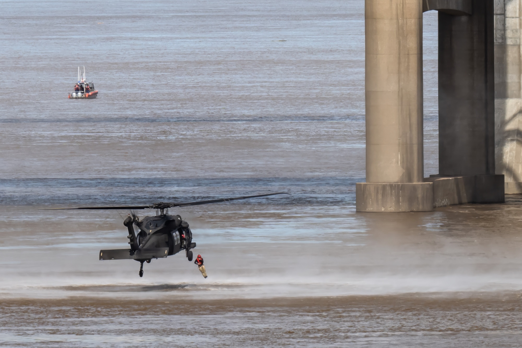 A pararescueman from the Kentucky Air National Guard’s 123rd Special Tactics Squadron leaps into the Ohio River from a Kentucky Army National Guard UH-60 Black Hawk as part of a helocast water-rescue demonstration during the Thunder Over Louisville air show in Louisville, Ky., April 20, 2024. This year’s event featured more than two-dozen military and civilian aircraft, including the Kentucky Air National Guard’s C130J Super Hercules. (U.S. Air National Guard photo by Dale Greer)