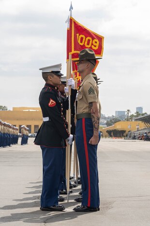 U.S. Marines with Alpha Company, 1st Recruit Training Battalion, retire the guidons during a graduation ceremony at Marine Corps Recruit Depot San Diego, California, April 19, 2024. Graduation took place at the completion of the 13-week transformation, which included training for drill, marksmanship, basic combat skills, and Marine Corps customs and traditions. (U.S. Marine Corps photo by Cpl. Sarah M. Grawcock)